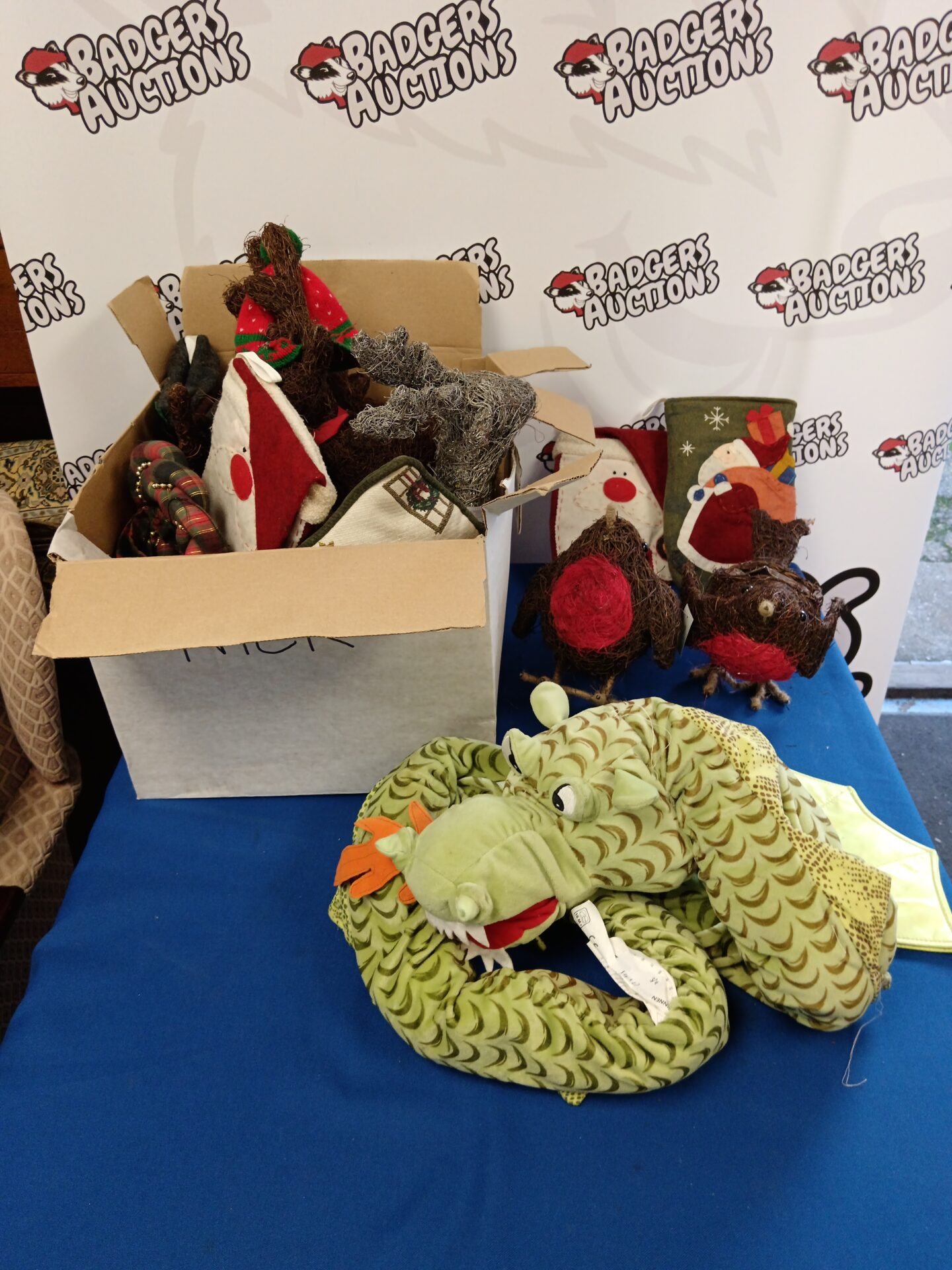 530 Box of Christmas decorations & dragon draft excluder
