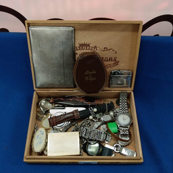Vintage watch and curio lot displayed in a wooden cigar box.