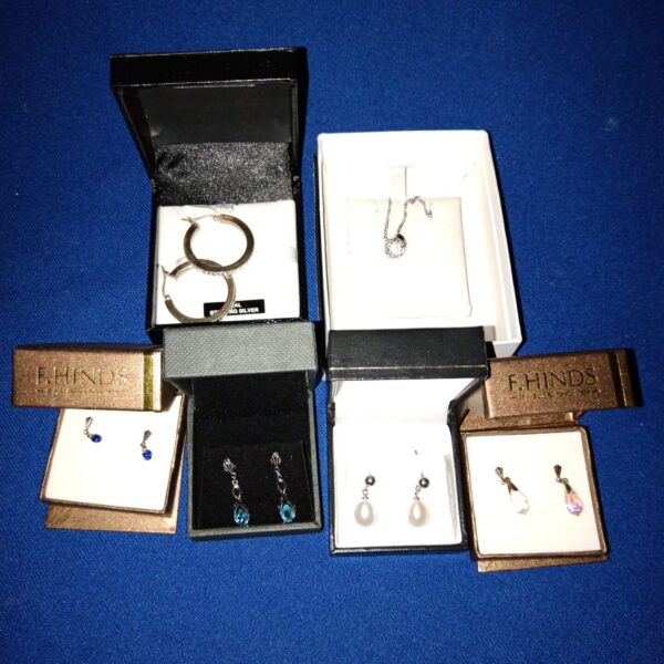 Close-up of sterling silver jewellery set in a presentation box.