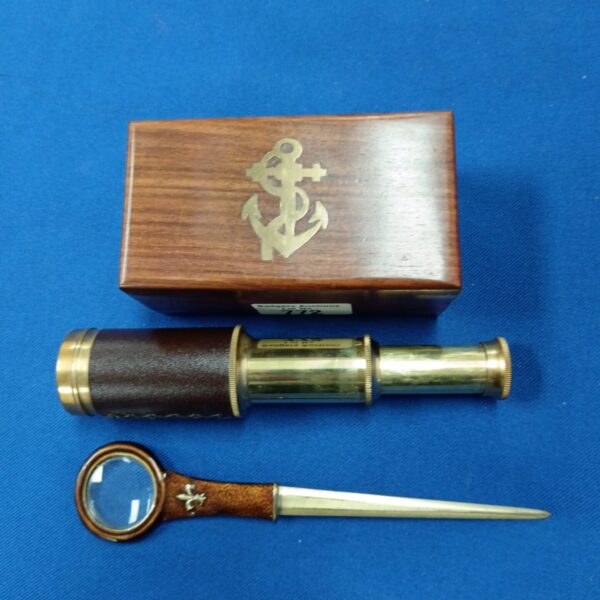 Vintage nautical desk set with telescope and fleur de lis letter opener.