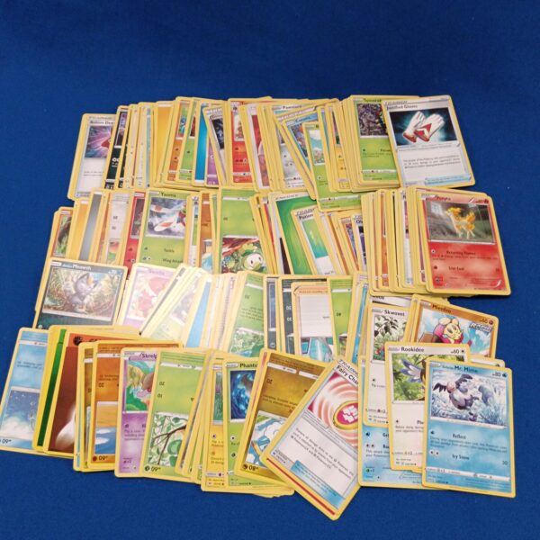 Pokémon card collection lot with various designs and characters.