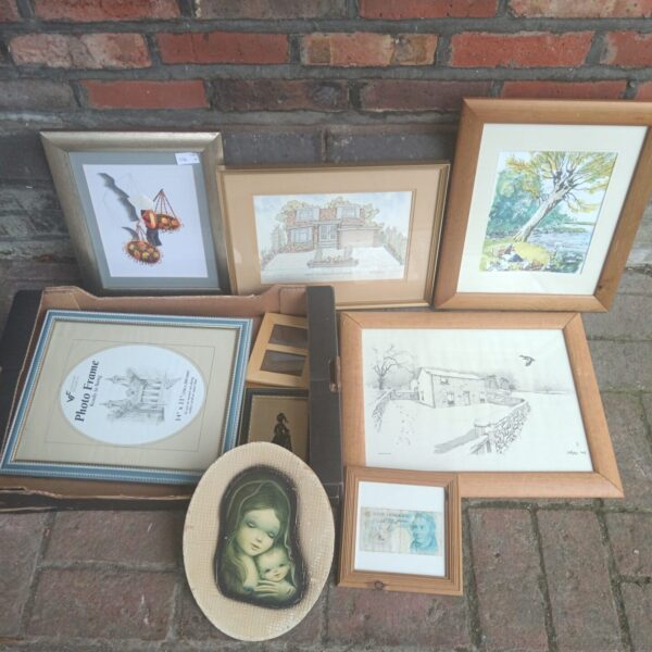 Collection of framed prints and artwork for vintage home decor.