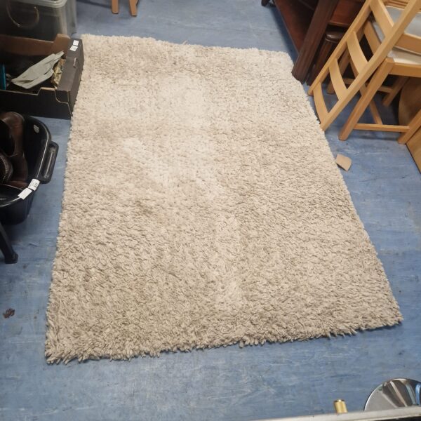 Soft Next woollen rug, approximately 6x4ft, ideal for living room decor.