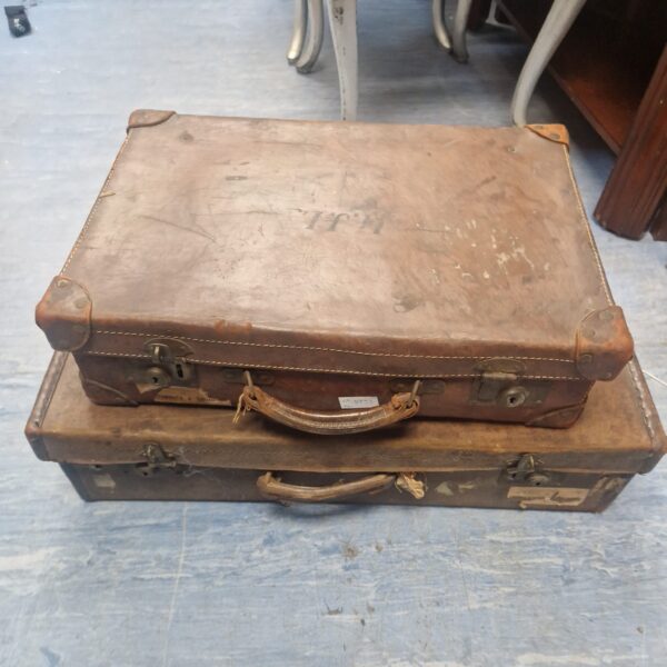 Close-up of a vintage brown leather suitcase.