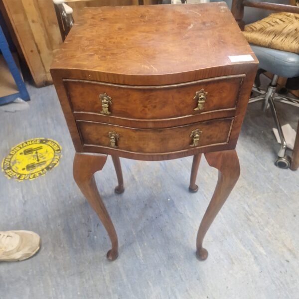 Vintage walnut two-drawer side table with elegant legs.