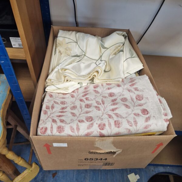 Mixed upholstery fabric remnants for crafting and restoration projects.