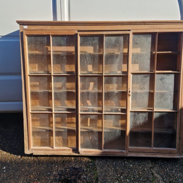 Antique Victorian kitchen display cabinet with glazed panes.
