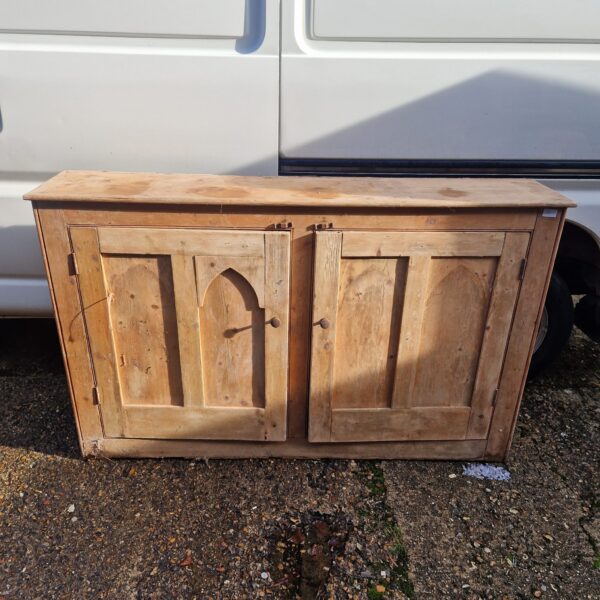 Vintage pine sideboard with two doors, rustic farmhouse style.