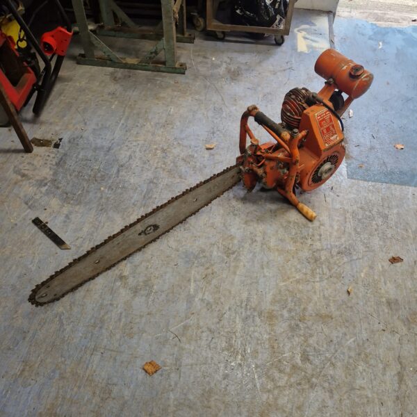Vintage Danarm chainsaw in used condition, ideal for collectors.