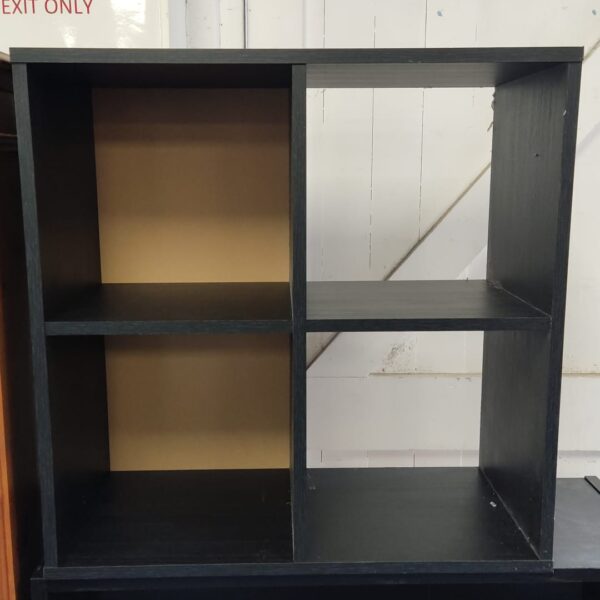 Black four-shelf unit for storage and display.