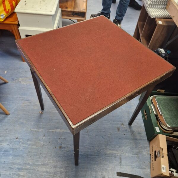 Vintage green felt folding card table for games.