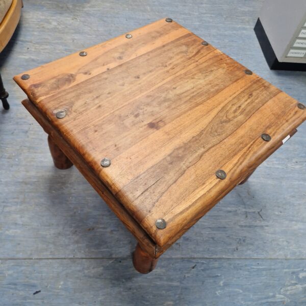 Rustic Indian oak coffee table with a low profile.