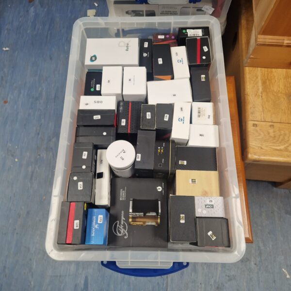Mixed lot of vape tanks and mod boxes for vaping enthusiasts.