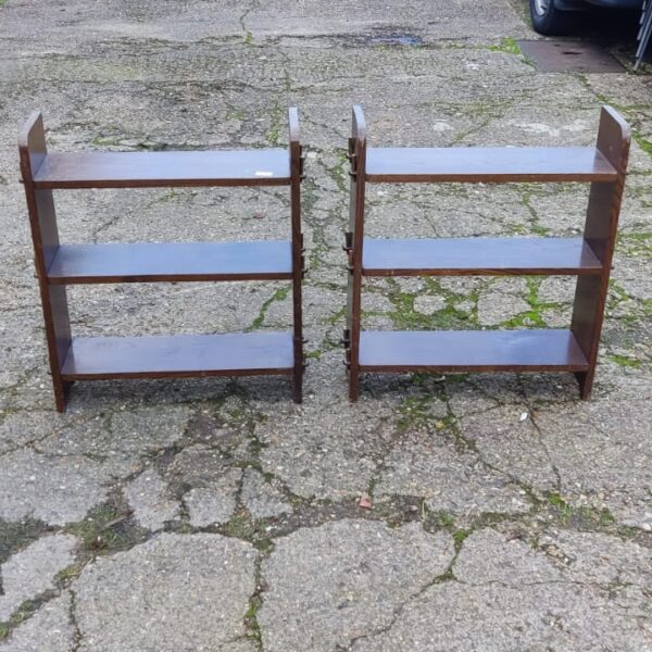 Pair of vintage wooden book shelves for home storage.