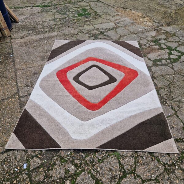 Beige and red patterned Dunelm rug measuring 160x230cm.
