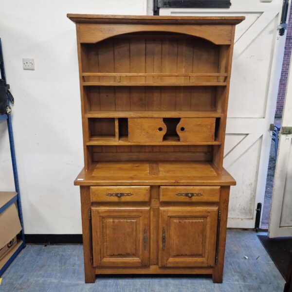 Antique solid oak Welsh dresser with open shelving.