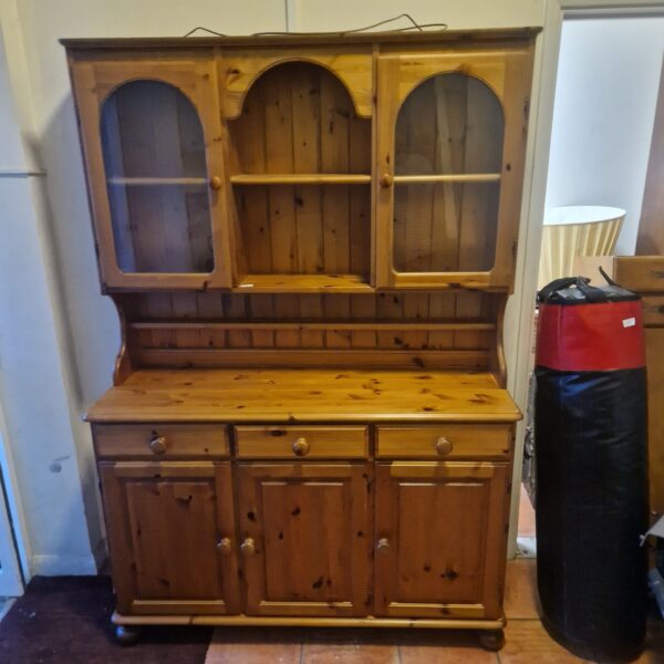Large pine Welsh dresser with open shelving and cupboard storage.