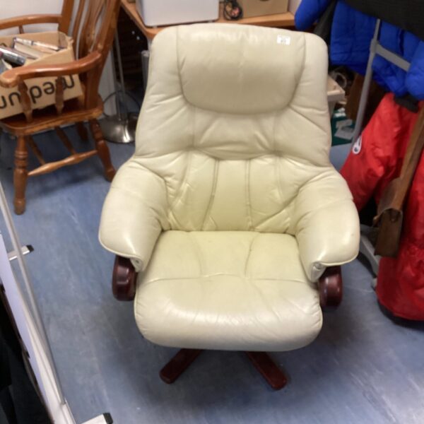 Cream leather Scandinavian armchair with swivel base.