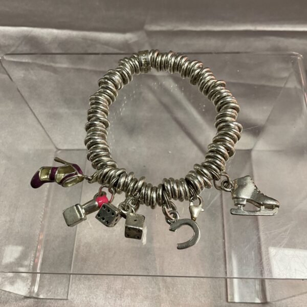 Links of London silver charm bracelet with detailed charms.