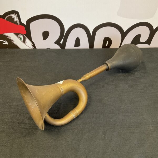 Vintage brass car horn, classic automobile accessory.
