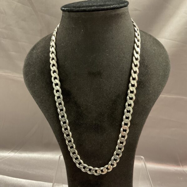 Close-up of a 925 silver curb chain necklace.