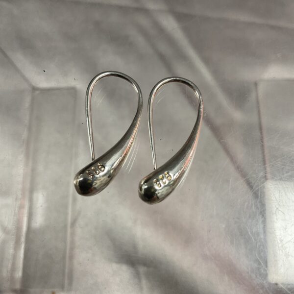 Silver Tiffany & Co. Elsa Peretti teardrop earrings, elegant designer jewellery.