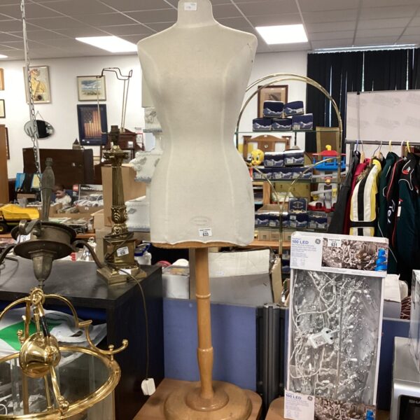 Vintage female dress form mannequin for tailoring and display.