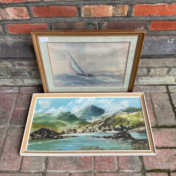 Vintage D Nicholls seascape oil painting with coastal cliffs and waves.