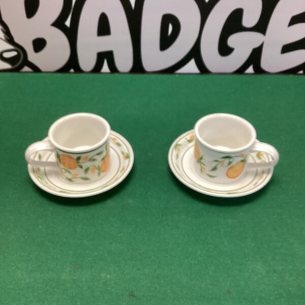 Vintage Portmeirion cups and saucers with hand-painted floral design.
