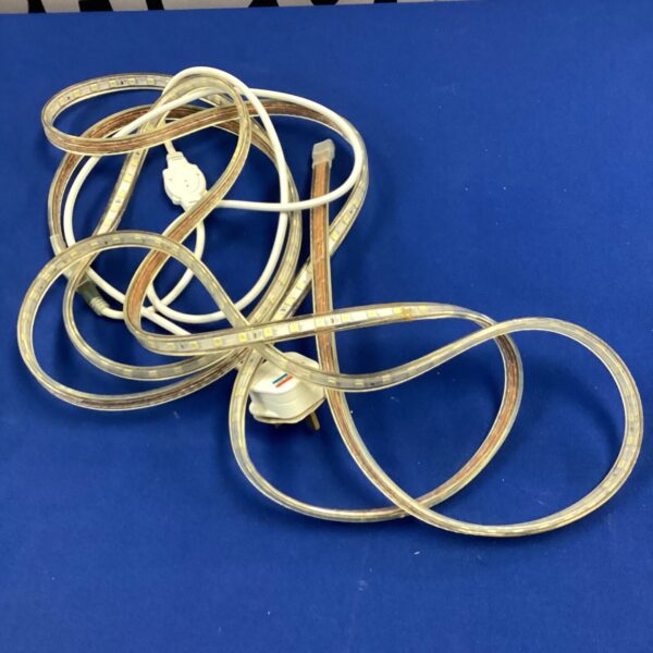 Flexible LED strip light with plug and adhesive backing.