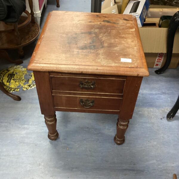 Vintage mahogany side table with a single drawer and turned legs.