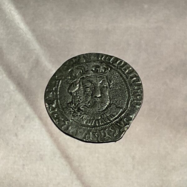 Obverse of a Henry VIII groat reproduction coin.
