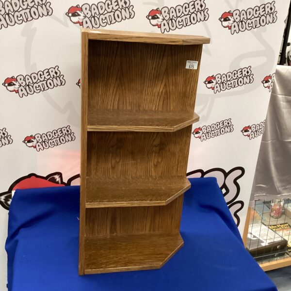 Vintage oak corner shelf unit for display and storage.