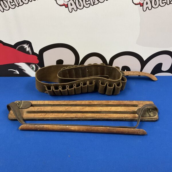 Antique game carrier and cartridge belt, vintage hunting equipment.