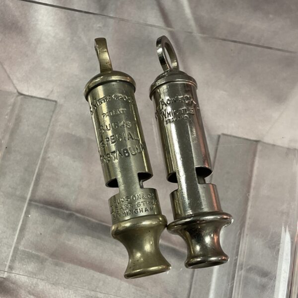 Pair of vintage Acme whistles, City and Metropolitan Police.