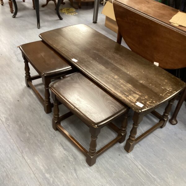 Vintage mahogany coffee table set with side tables.