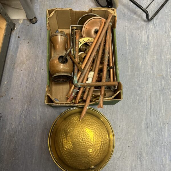 Assorted vintage brass and copper components in a cardboard tray.
