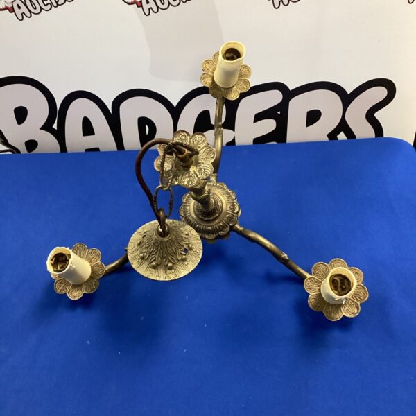 Vintage brass ceiling light with candelabra arms.