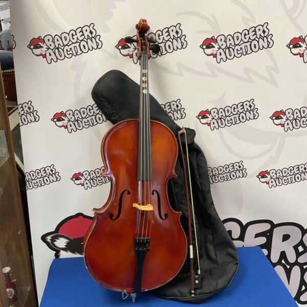 Vintage Hungarian child's cello with bow and case.
