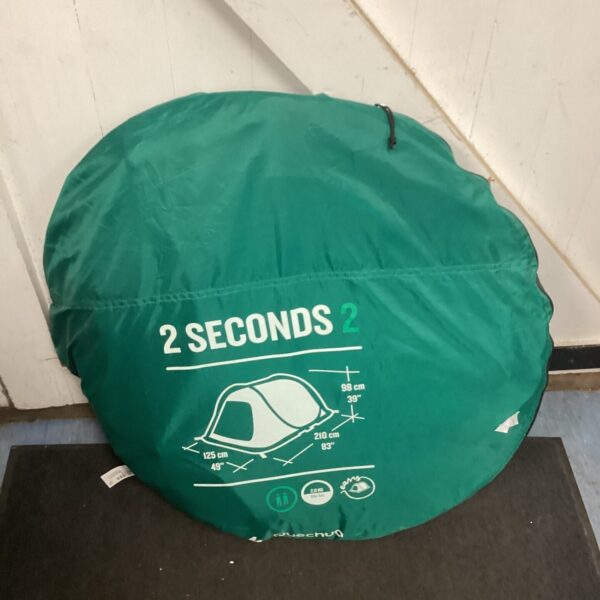 Decathlon 2 person pop up tent in folded condition.