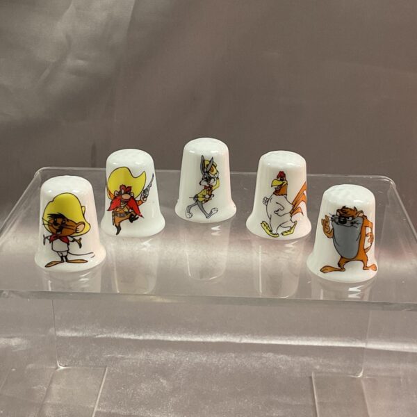 Looney Tunes thimble lot featuring Bugs Bunny and Taz.
