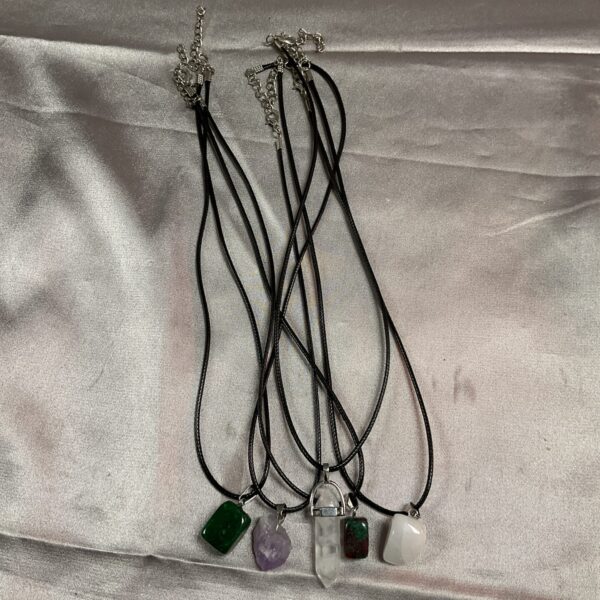 Lot of five crystal rope necklaces with amethyst, aventurine, and other stones.