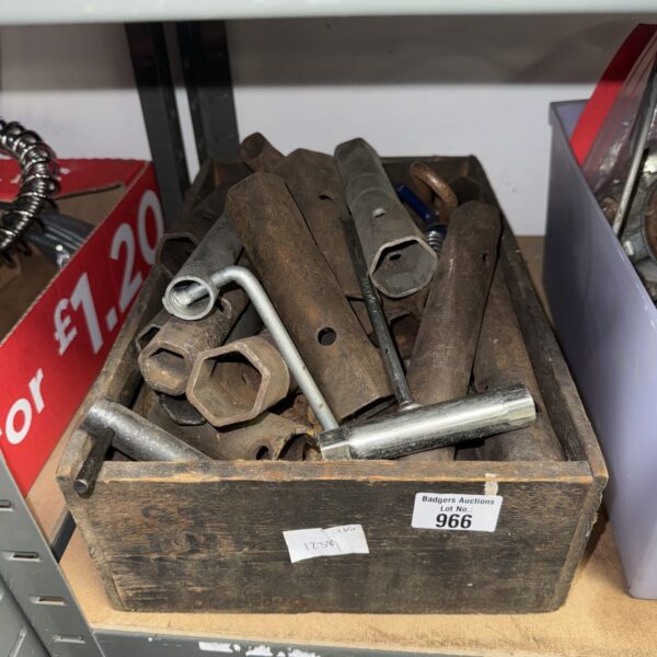 Vintage box spanners displayed in a wooden tray, ideal for collectors.