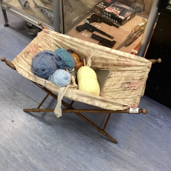 Vintage French folding knitting basket with yarn inside.
