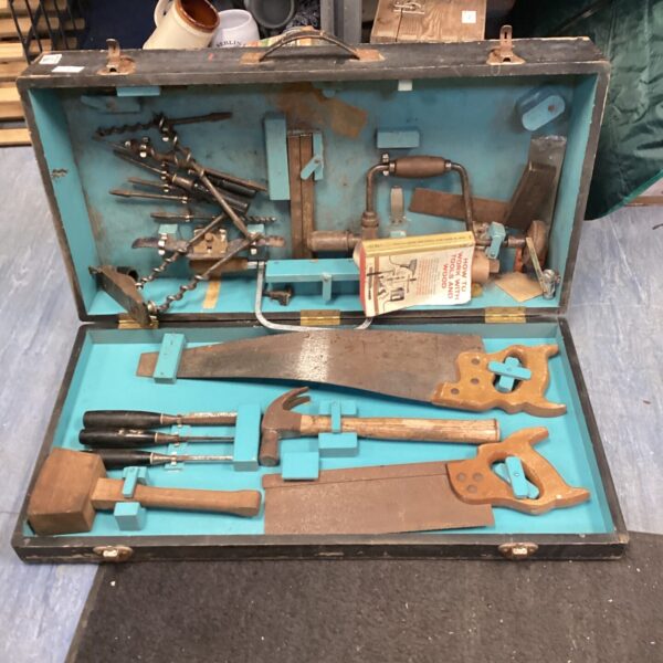 Vintage carpenter's tool box filled with woodworking tools.