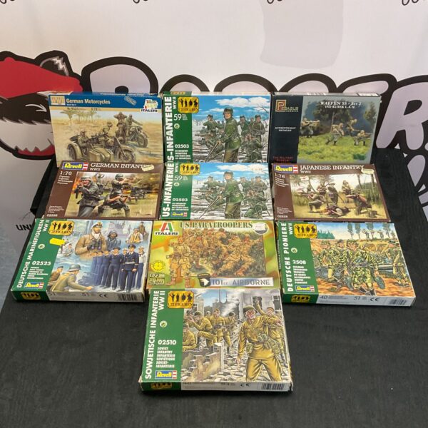 Ten boxes of vintage and modern WWII model soldiers from Revell, Italeri, and Pegasus.