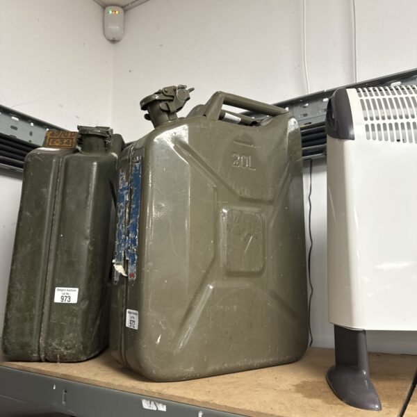 Vintage 20 litre metal jerry can, showing signs of wear.