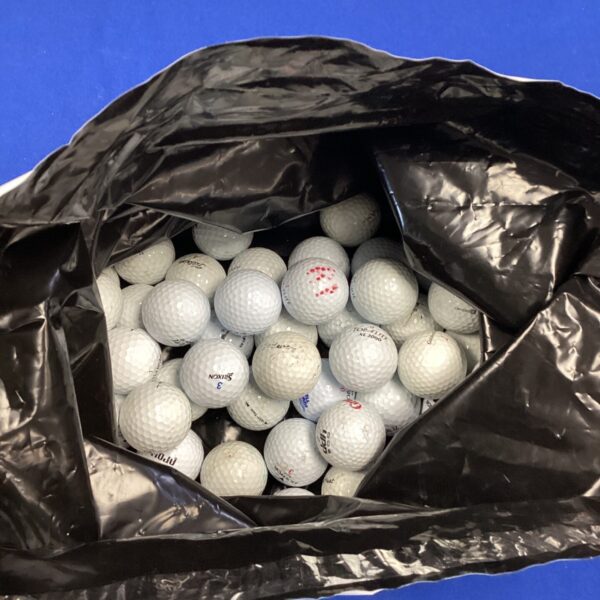 Mixed lot of used golf balls including Top Flite and Grants.