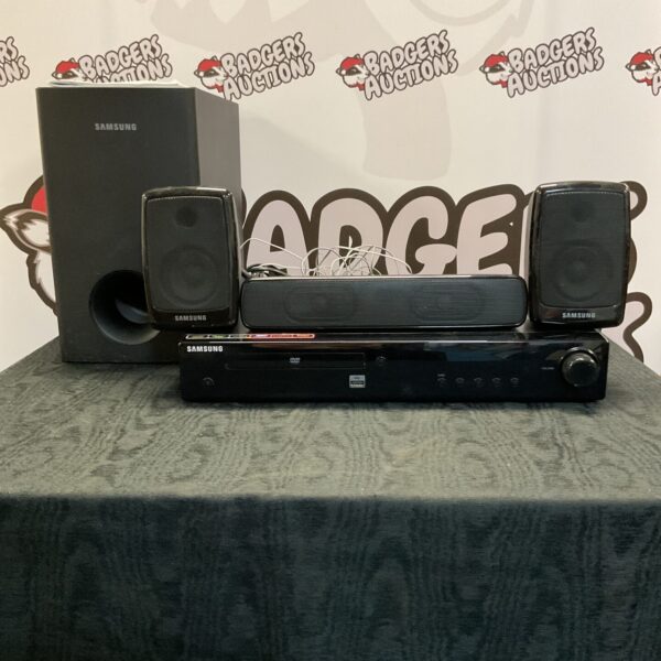 Samsung HT-Z220 home cinema system with speakers and subwoofer.