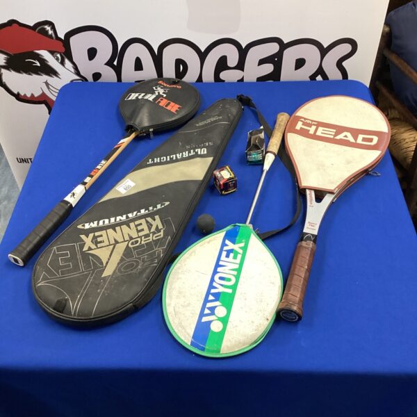 Selection of squash rackets and balls for sports enthusiasts.
